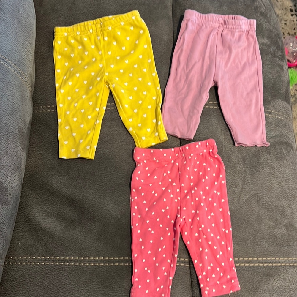 Baby girl pants size 0-3 months pink and yellow hearts and solid purple.